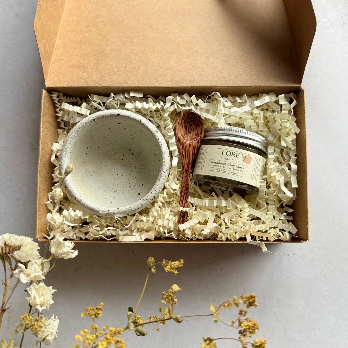 This beautifully presented botanical clay mask gift box comes with either our pink or green clay mask blend, a small locally made ceramic bowl & a mini coconut spoon - ready to create a moment of self care.
Our clay mask blends are made up of 8 clays & plant powders which are packed with botanical goodness. They will naturally boost & brighten dull tired looking skin, leaving your complexion cleansed & radiant.