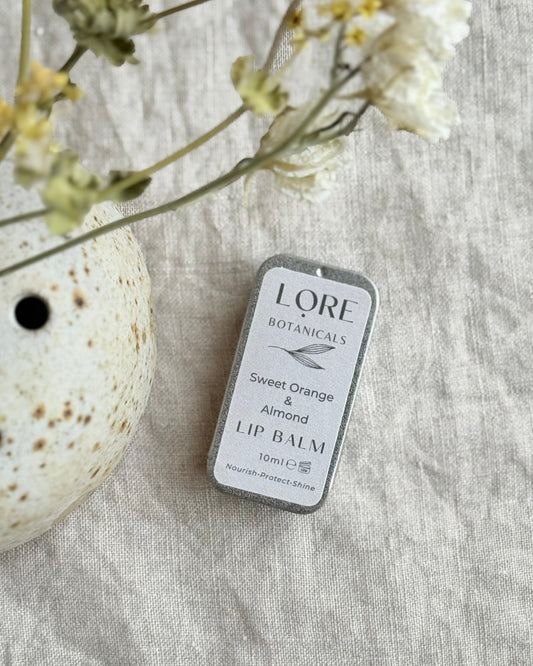 This wonderfully moisturising zesty lip balm is perfect for lips needing a little extra tlc.
Packed with deeply moisturising mango butter & the skin protecting qualities of beeswax (locally sourced), together with vitamin rich skin loving oils of almond, coconut & grape seed, this restorative blend will moisturise, soften, protect & give your lips a gorgeous sheen.